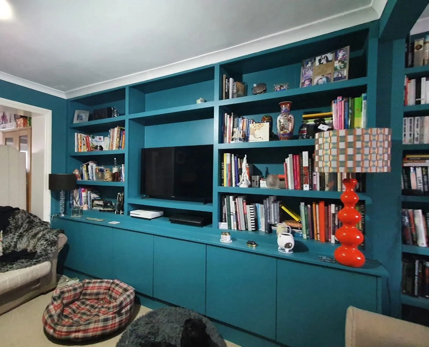 Media wall with concealed cabling and shelving